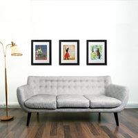 Three Framed Art Prints Hanging on a Wall