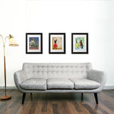 Colorful animal art above a couch by Pergamo Paper Goods