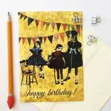 Yellow greeting card photographed with pencil and envelope