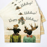 Set of gay Christmas cards featuring a moose couple under mistletoe, text reads happy holidays. Gay moose, love moose cards