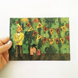 Hand holding birthday card featuring a vintage fox